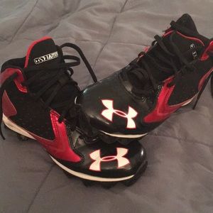 UA high top cleats.